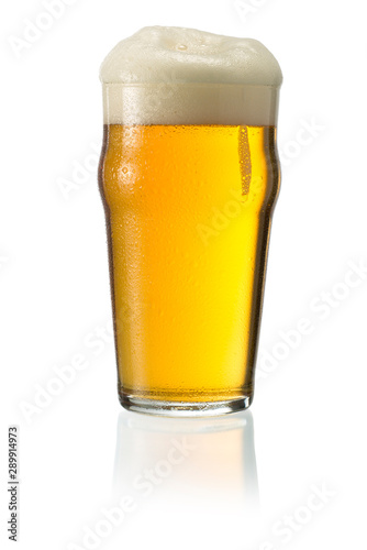 Glass of blonde beer with foam