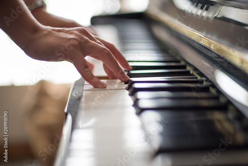 hands playing piano