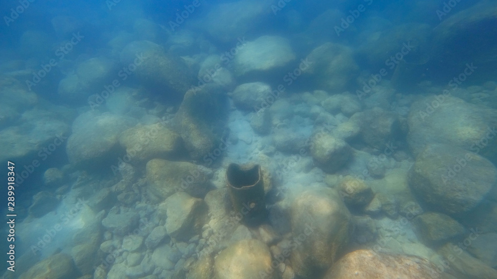 Fototapeta premium Rusty pipe under water