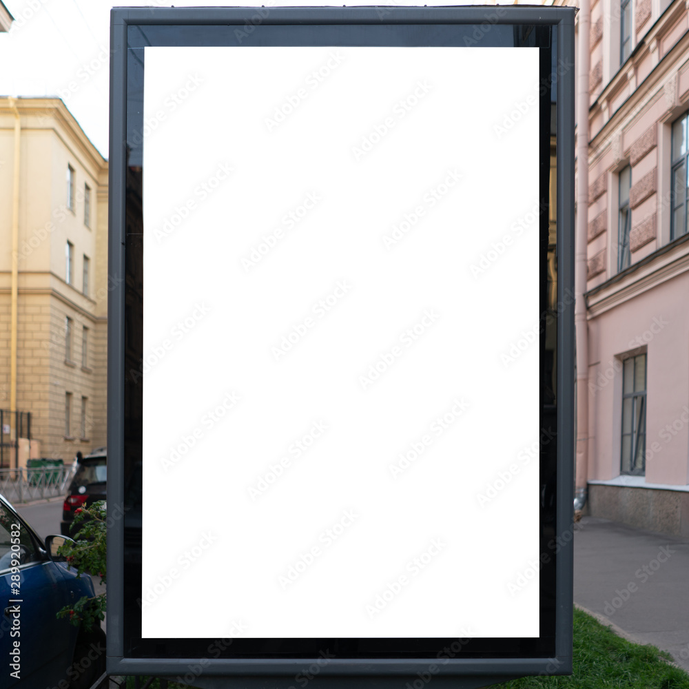White vertical billboard with white mockup background advertising field. standing in the city White vertical billboard with white mockup background advertising field. standing in the city