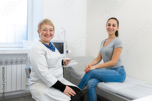 Young girl patient and experienced doctor. Girl on the advice of a doctor