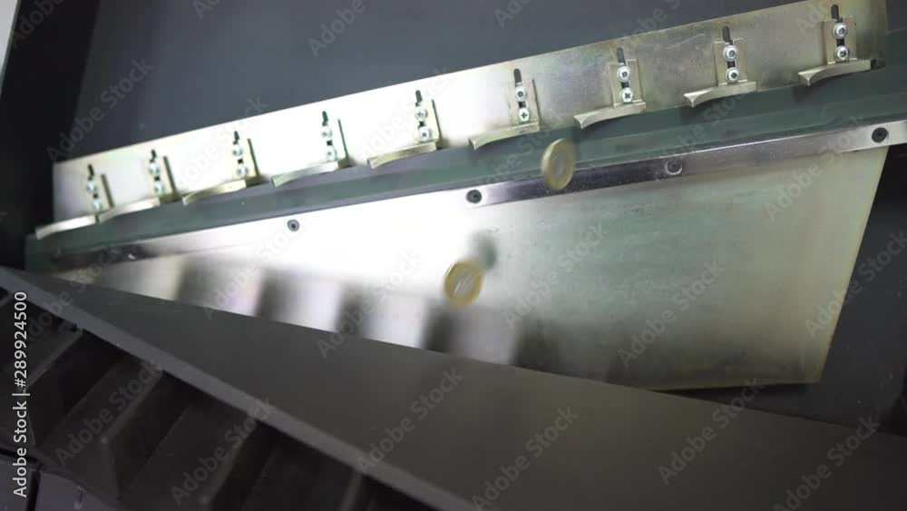 Slow Motion View Of Coins From Vending Machine Rolling Inside Coin