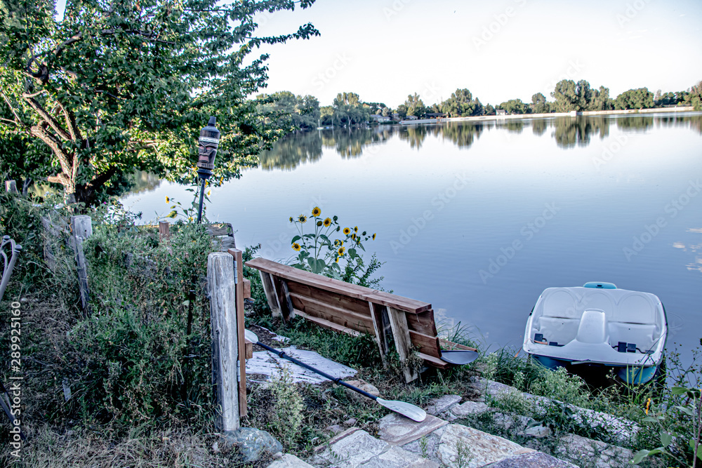 Colorado village lake with boats and daisies Colorado village lake with boats and daisies