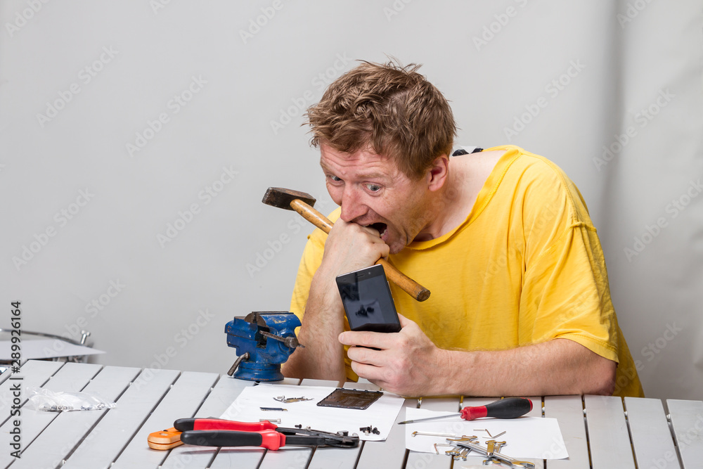Man repairing cell phone