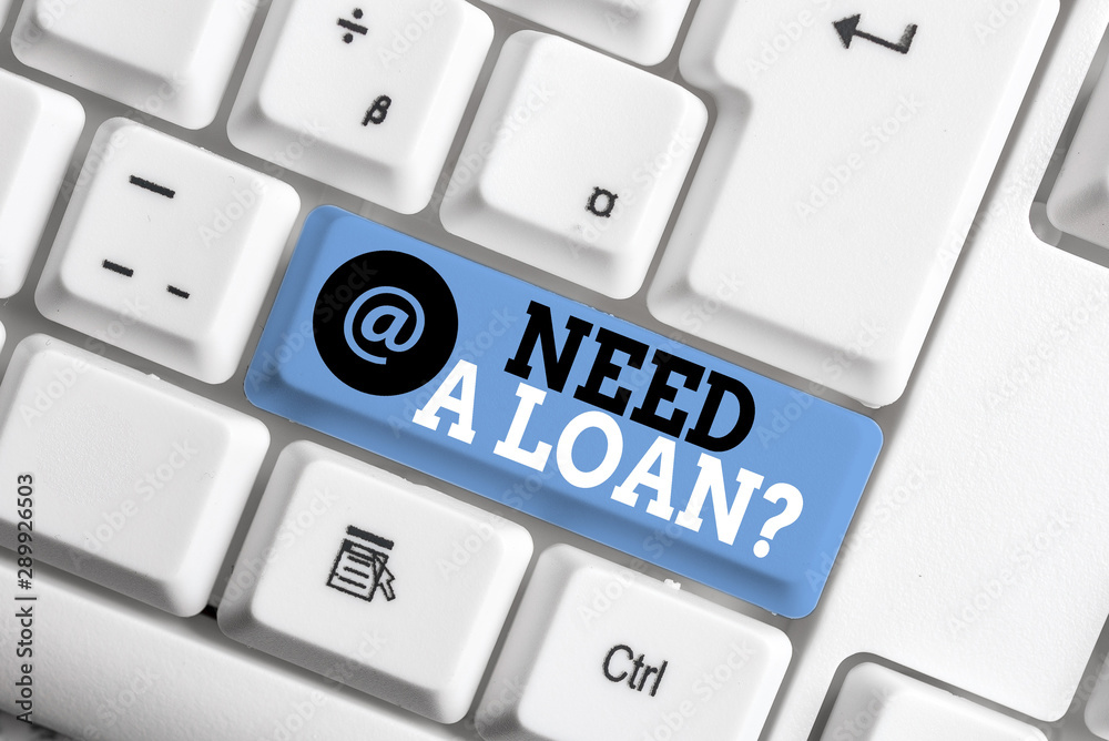 Text sign showing Need A Loan Question. Business photo showcasing asking he need money expected paid back with interest White pc keyboard with empty note paper above white background key copy space Text sign showing Need A Loan Question. Business photo showcasing asking he need money expected paid back with interest White pc keyboard with empty note paper above white background key copy space