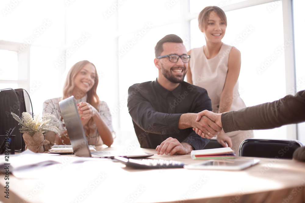 background image of the handshake of business partners in the office background image of the handshake of business partners in the office