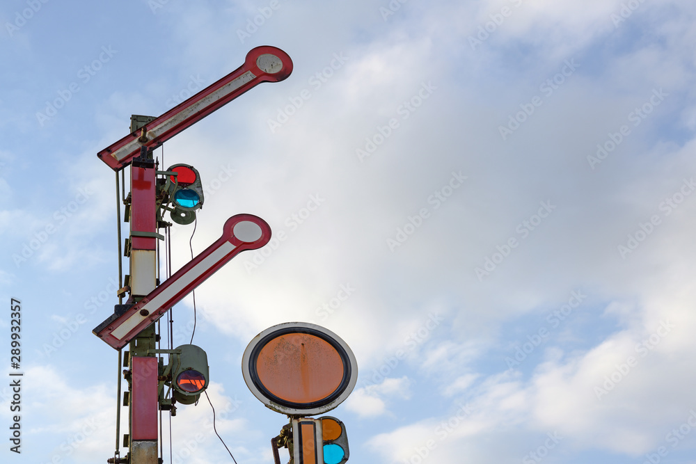 Railroad signal against the blue sky with clouds, copy space Railroad signal against the blue sky with clouds, copy space