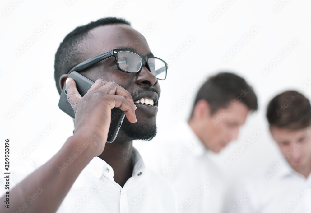 close up.successful businessman talking on mobile phone