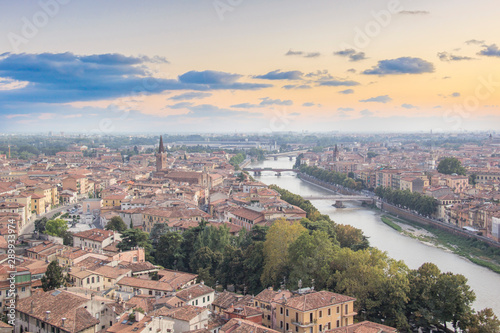 Beautiful view of the panorama of Verona and the Lamberti tower on the banks of the Adige River in Verona, Italy