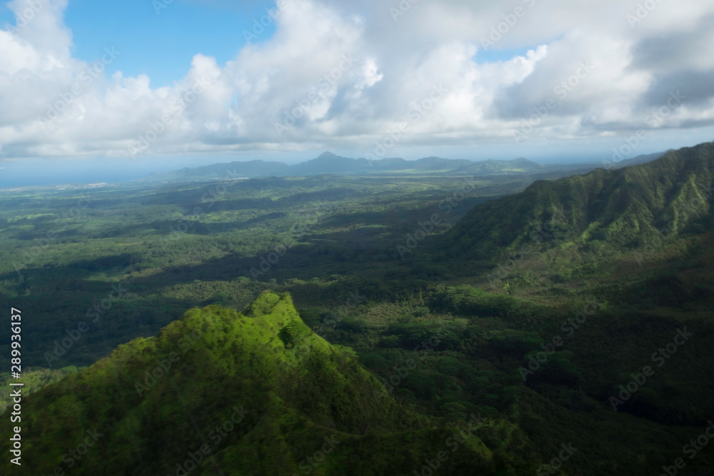 Kauai island landscape with green hills and clouds 