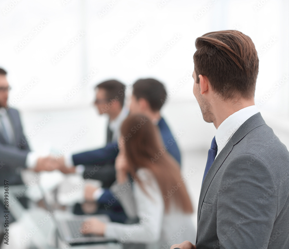 rear view. businessman looking at workplace rear view. businessman looking at workplace