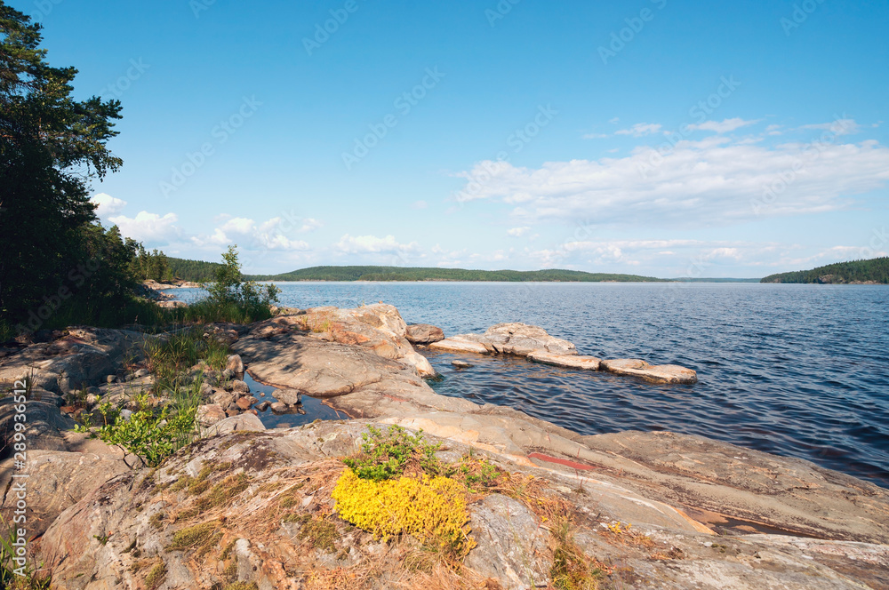 Picturesque coast of the island of Mussarat on lake Ladoga . Picturesque coast of the island of Mussarat on lake Ladoga .