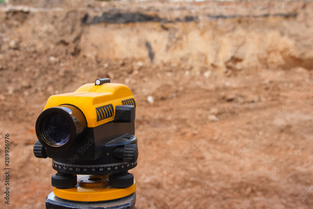 Surveyor equipment at a construction site. Measuring instrument close-up.