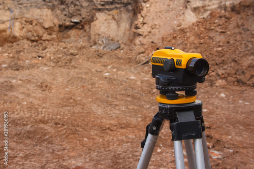 Surveyor equipment at a construction site. Measuring instrument close-up.