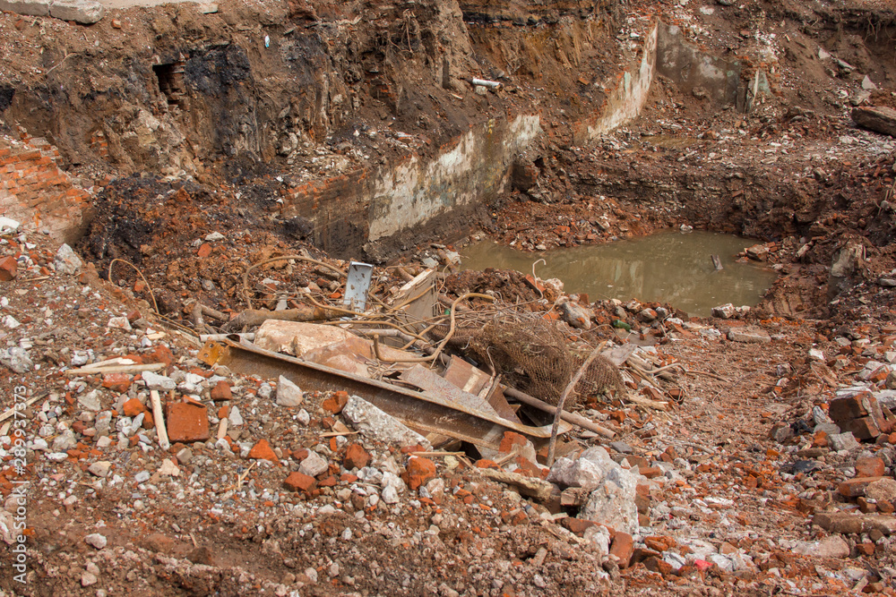 Broken brick at a construction site. Construction waste after dismantling. Broken brick at a construction site. Construction waste after dismantling.