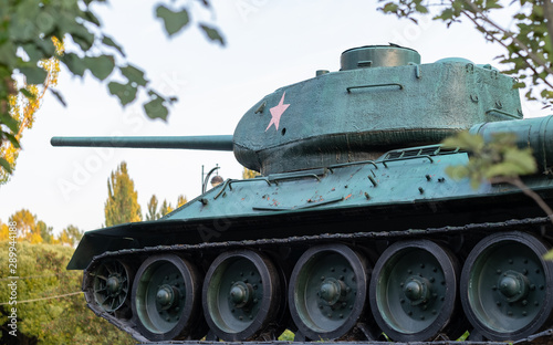 Soviet tank on the battlefield in the summer photo
