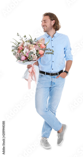 Young handsome man with beautiful flower bouquet on white background