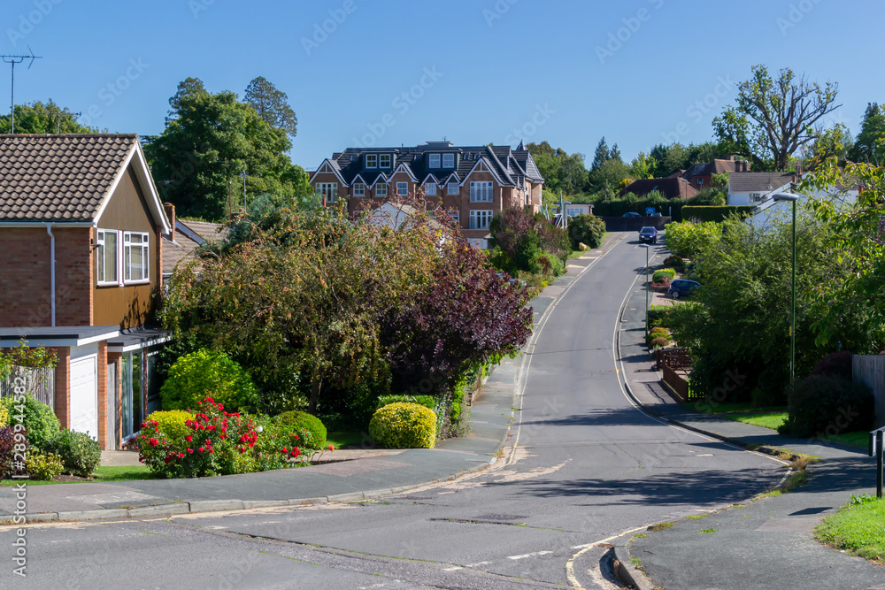 English village street view with houses and road