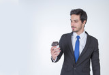 Handsome business man with a coffee cup during take a  break and refresh white background.
