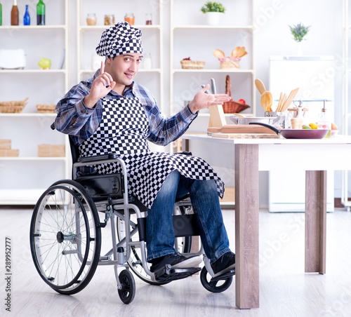 Disabled young man husband working in kitchen © Elnur