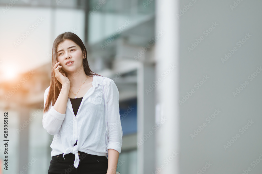 Asia woman using smartphone working playing with fun and happy in free time. Asia woman using smartphone working playing with fun and happy in free time.