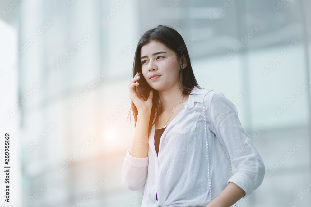 Asia woman using smartphone working playing with fun and happy in free time. Asia woman using smartphone working playing with fun and happy in free time.