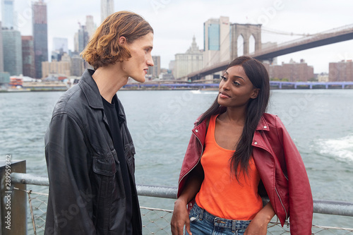 Young couple together in outside near Hudson River in New York