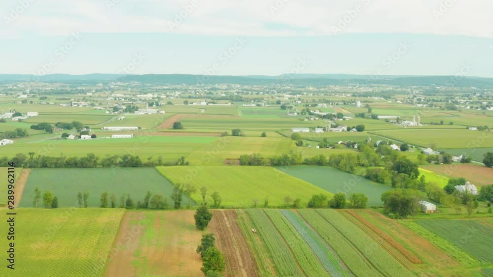Aerial View of Rural Farmland In Pennsylvania with Amish Horse and Buggy Aerial View of Rural Farmland In Pennsylvania with Amish Horse and Buggy