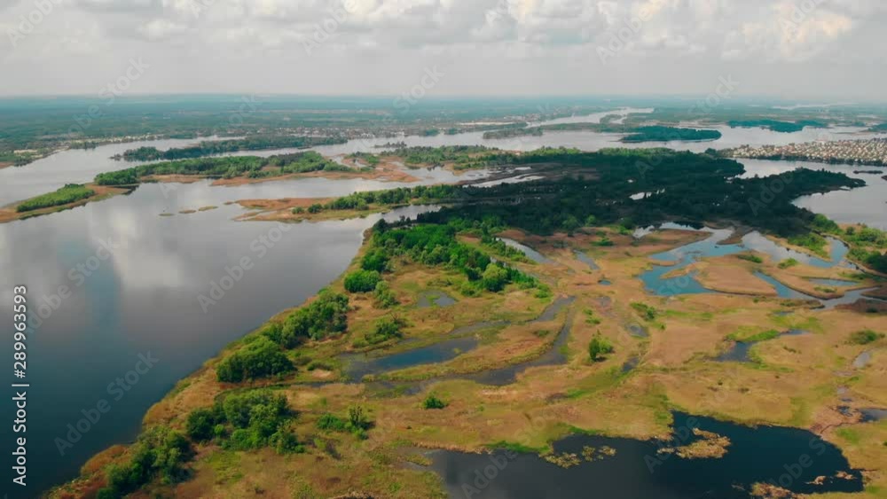 drone flying above river with piece of land sky with clouds nature view drone flying above river with piece of land sky with clouds nature view