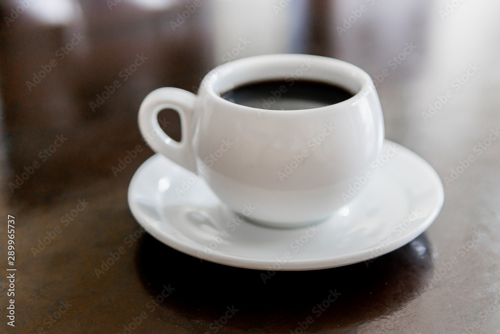 Tada with coffee, white color in small plate on the table. Tada with coffee, white color in small plate on the table.