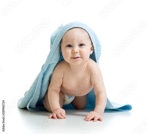 Happy toddler baby infant in diaper covered bathin towel. Isolated on white photo