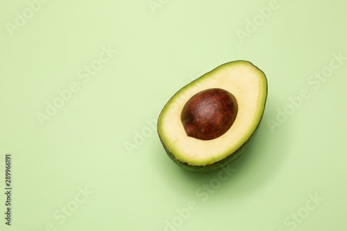 Avocado on green background