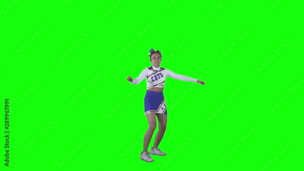JAKARTA, Indonesia - September 10, 2019: Slow motion of attractive cheerleader jumping in the studio with green screen background JAKARTA, Indonesia - September 10, 2019: Slow motion of attractive cheerleader jumping in the studio with green screen background