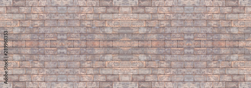 Dark brown old bricks wall panorama. Abstract brick texture for design or wallpaper.