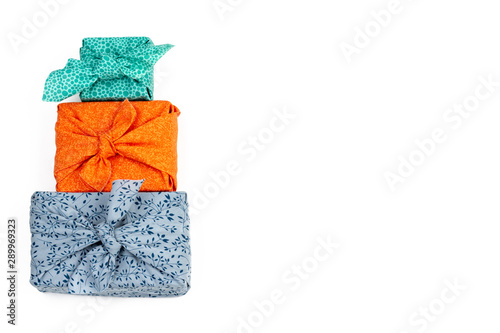 Φωτογραφία Fabric wrapped gifts, reusable sustainable recycled textile gift wrapping altern