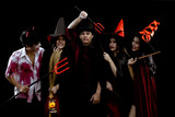 Group young Asian in costume Halloween party on black background.