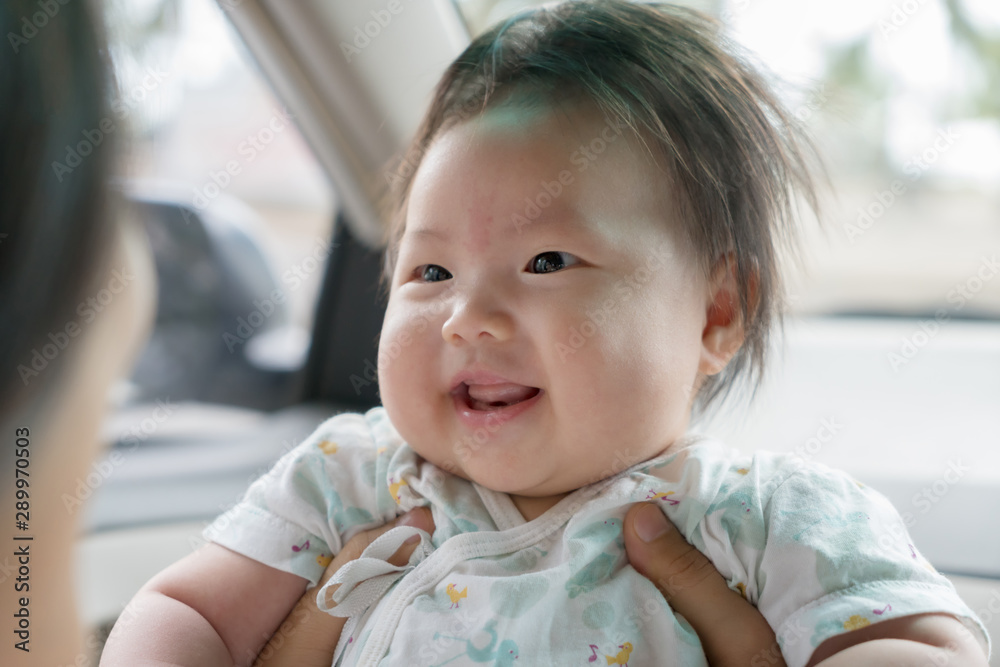 Three month old girl looking at her mother and smiling. Three month old girl looking at her mother and smiling.