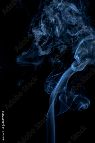 Blue smoke on dark background