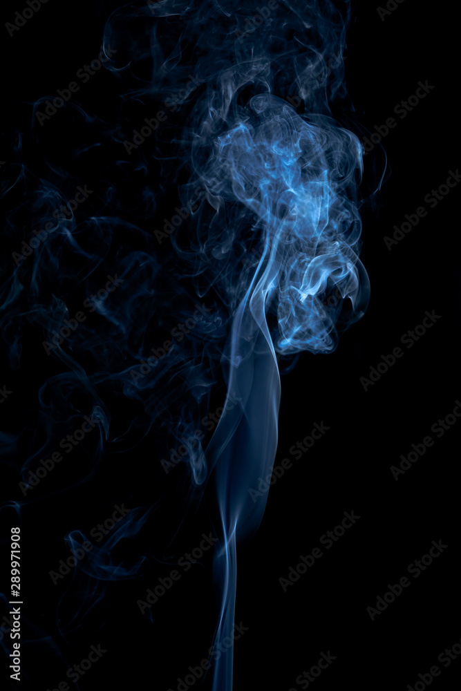 Fototapeta premium Blue smoke on dark background