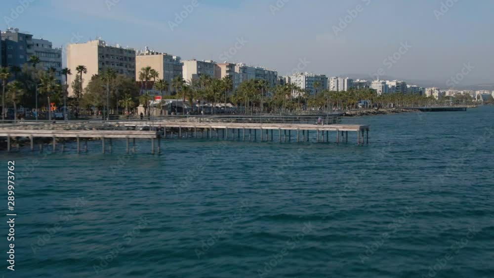 Flying over sea in Limassol coastline on a sunny day