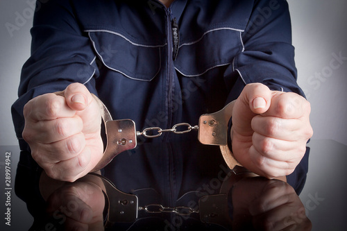 Prisoner with handcuffs on hands