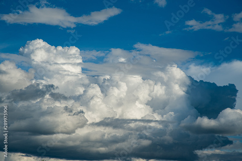 Beautiful white fluffy clouds with blue sky background.