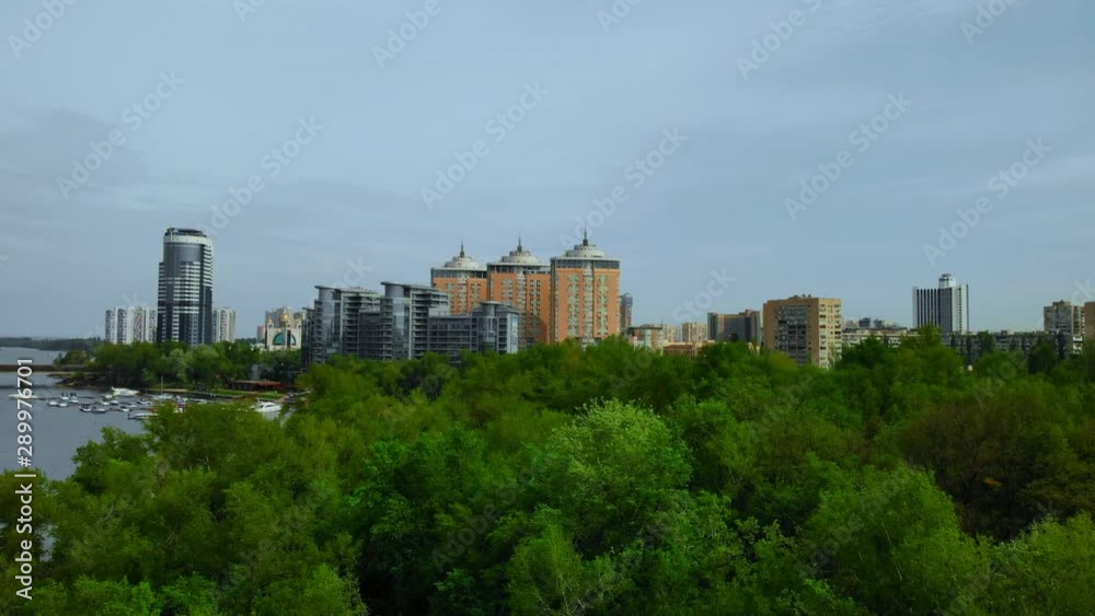 aerial view on the residential area near river pier with boats modern buildings in city aerial view on the residential area near river pier with boats modern buildings in city