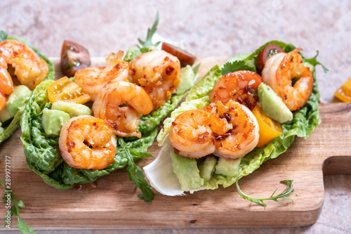 Lettuce wrapped Shrimp tacos with fresh tomato, avocado and lime