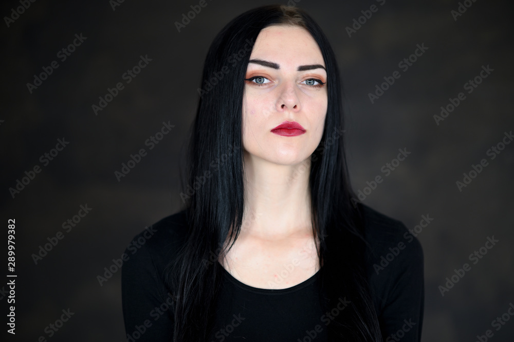 Concept close-up portrait of a pretty brunette girl on a colorful background in the studio. Concept close-up portrait of a pretty brunette girl on a colorful background in the studio.