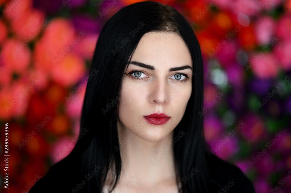 Concept close-up portrait of a pretty brunette girl on a colorful background in the studio. Concept close-up portrait of a pretty brunette girl on a colorful background in the studio.