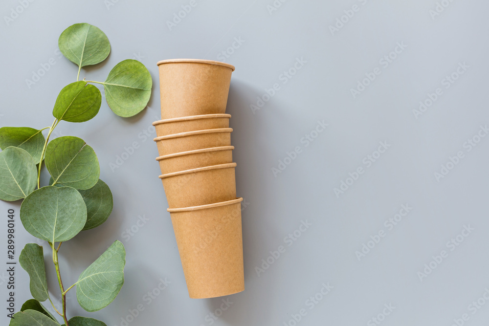eco natural paper coffee cups flat lay on gray background. sustainable ...