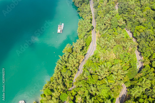 road in forest with a boat at Sun Moon Lake