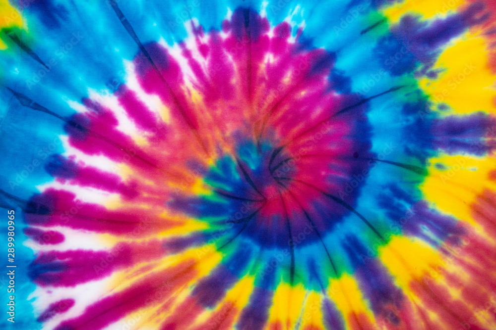 Tie dye rainbow color spiral abstract pattern background . hippie and