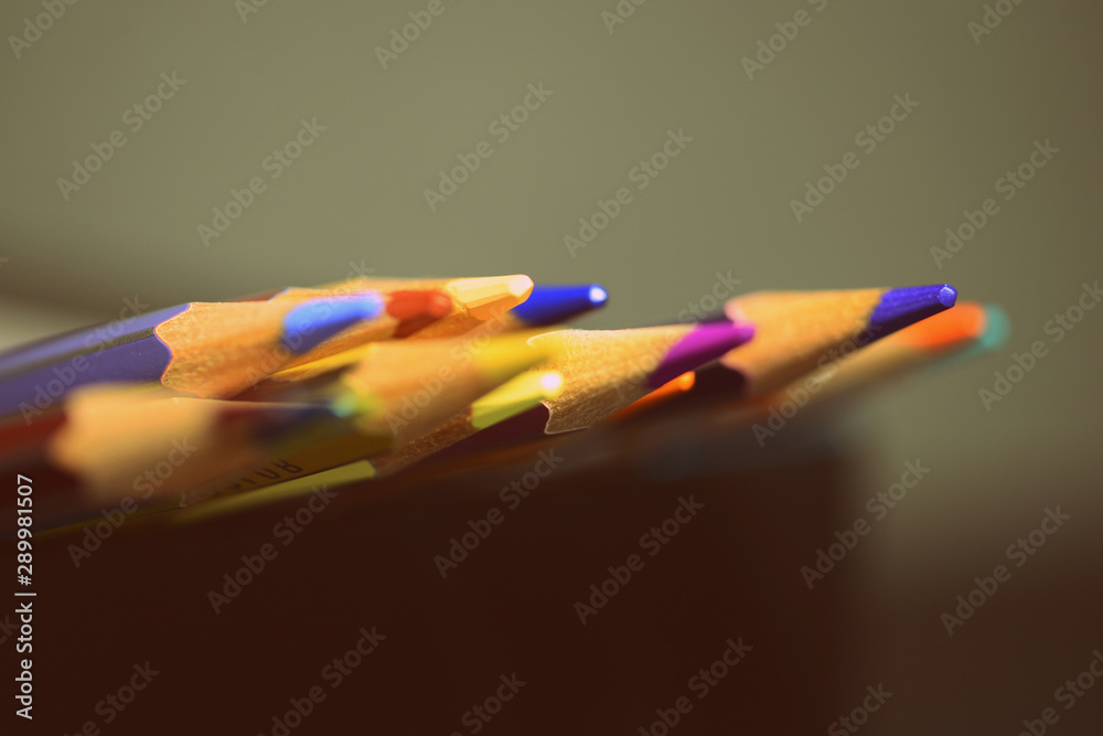 Colored pencils on a dark background close up. Retro style Colored pencils on a dark background close up. Retro style